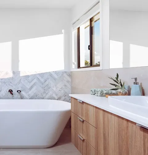 Freestanding bath and quality inclusions in an Ownit Homes bathroom