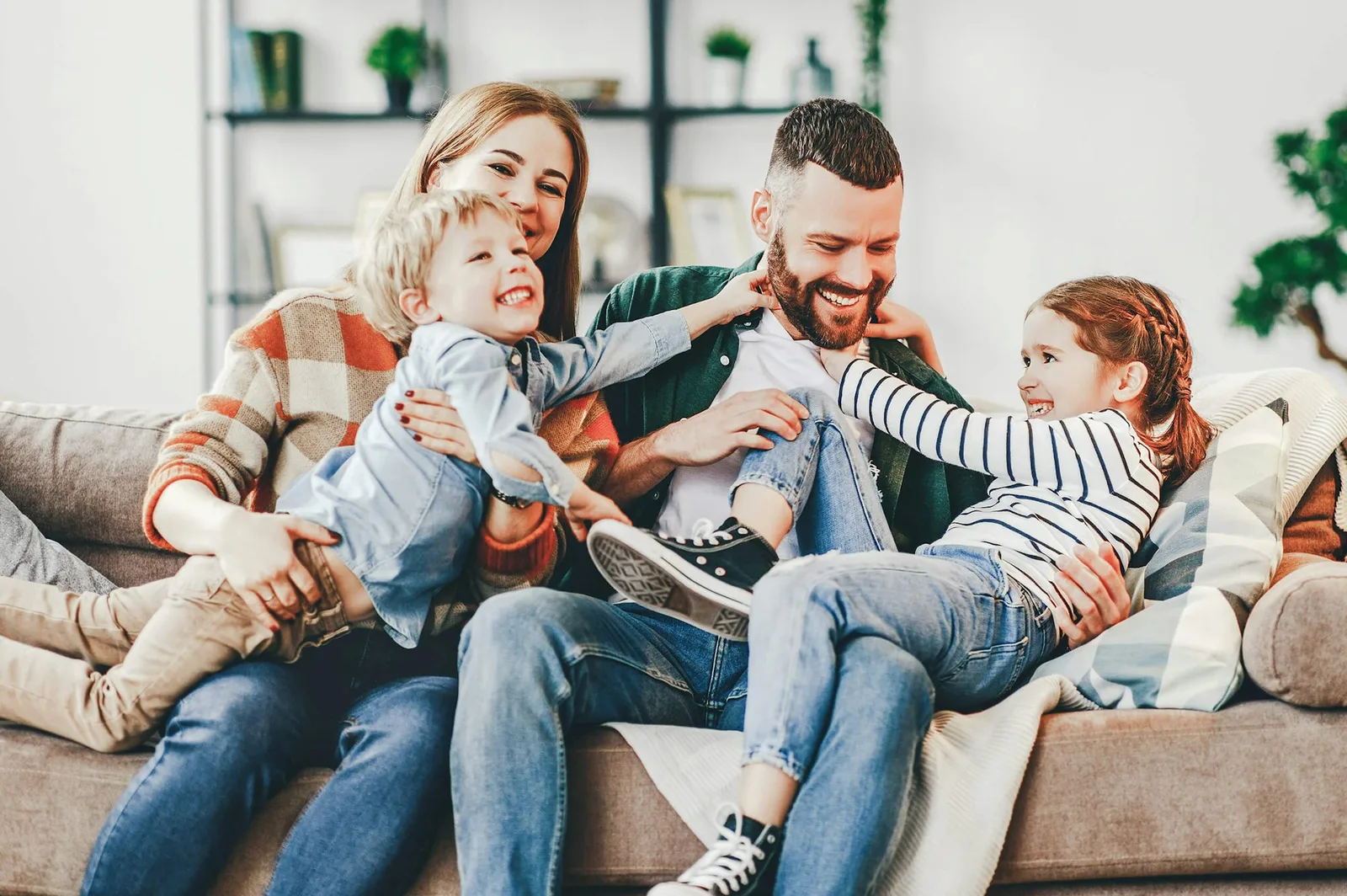 Family relaxing on the couch in their Ownit home