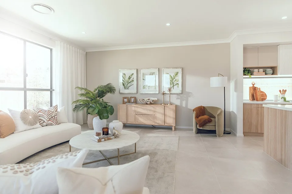Open living flowing from kitchen and dining