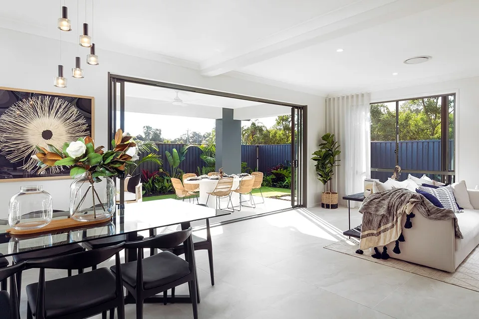 Open-plan living and dining flowing to the alfresco.